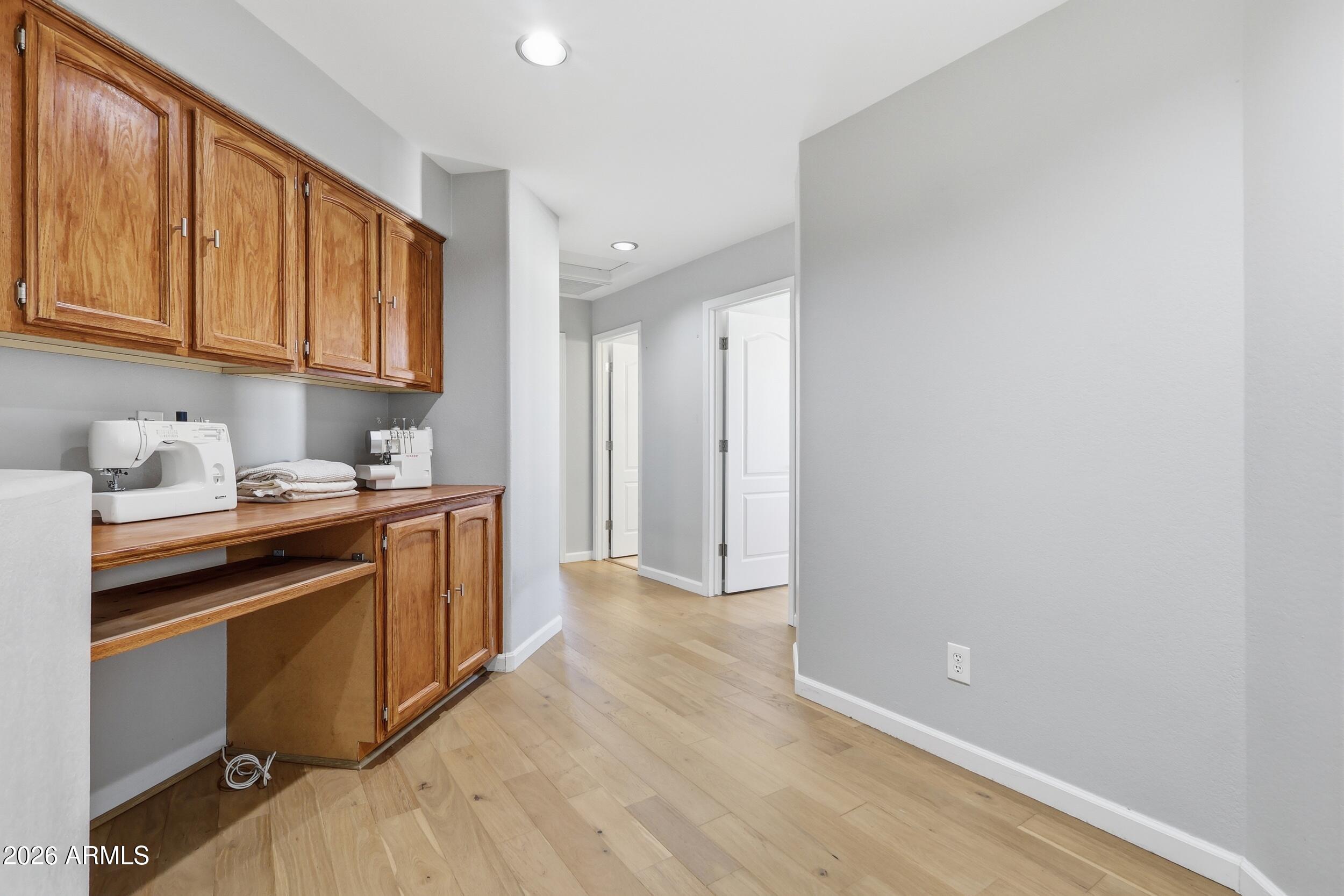 14025 South 44th Street Phoenix, AZ 85044 - Photo 21 of 52 a kitchen with stainless steel appliances granite countertop a refrigerator a sink dishwasher and wooden cabinets with wooden floor