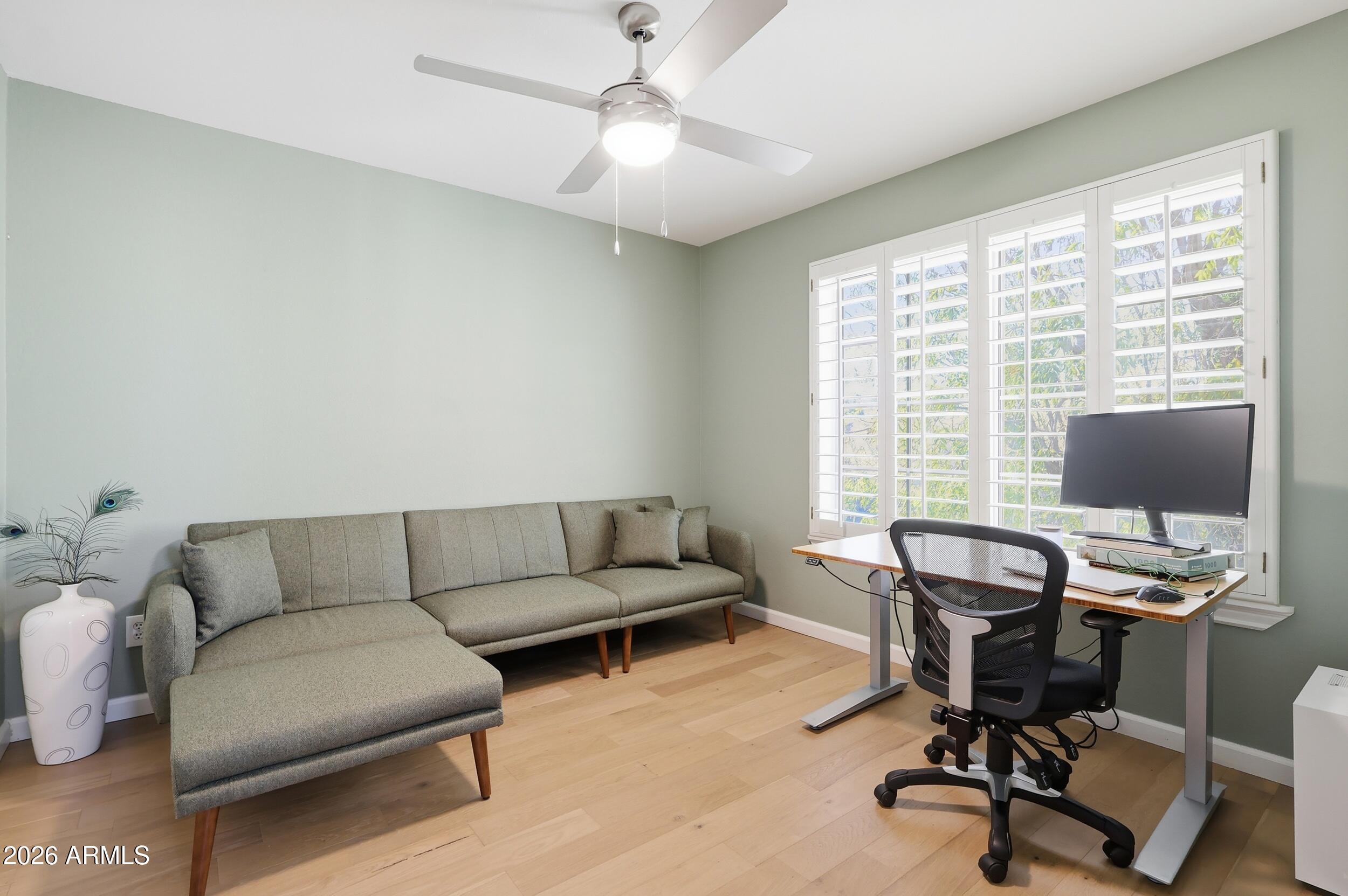 14025 South 44th Street Phoenix, AZ 85044 - Photo 22 of 52 a view of a livingroom with workspace and a couch