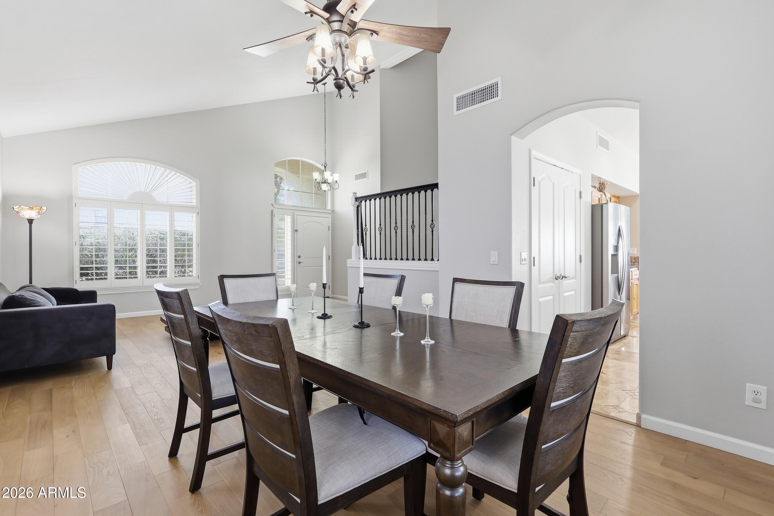 14025 South 44th Street Phoenix, AZ 85044 - Photo 5 of 52 a view of a dining room with furniture and wooden floor