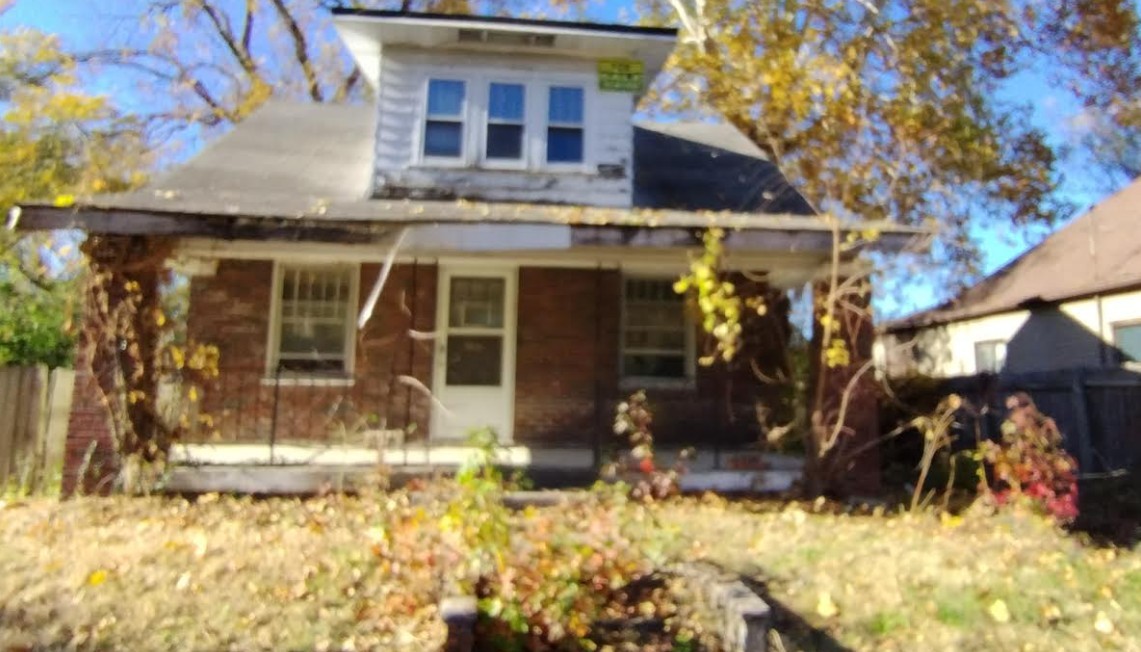 a view of a building with a tree
