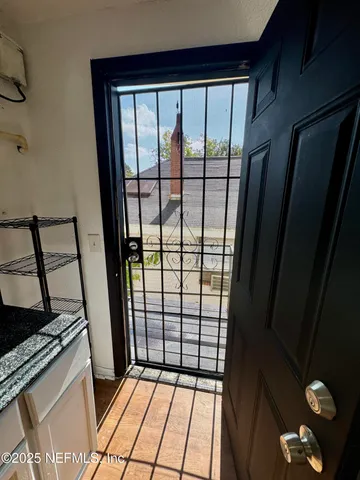 a view of balcony with wooden floor and fence