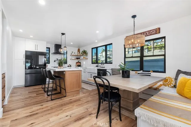 a view of kitchen with a table and chairs in it