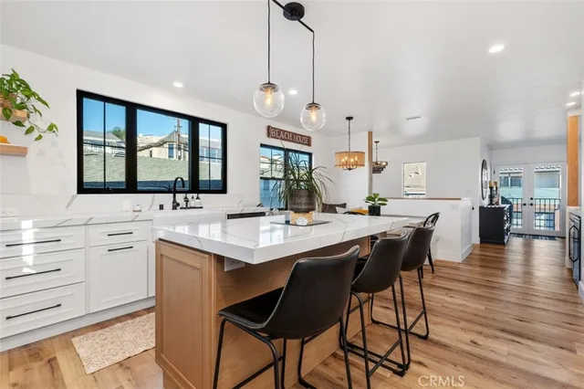a kitchen with counter space dining table and chairs
