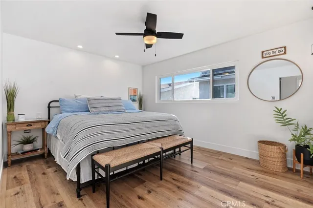 a bedroom with furniture and a window