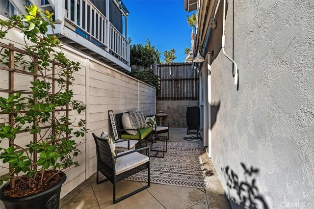 a backyard of a house with outdoor seating