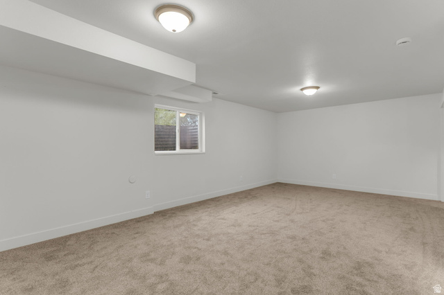11976 Woodridge Road Sandy, UT 84094 - Photo 29 of 40 Large basement rec room