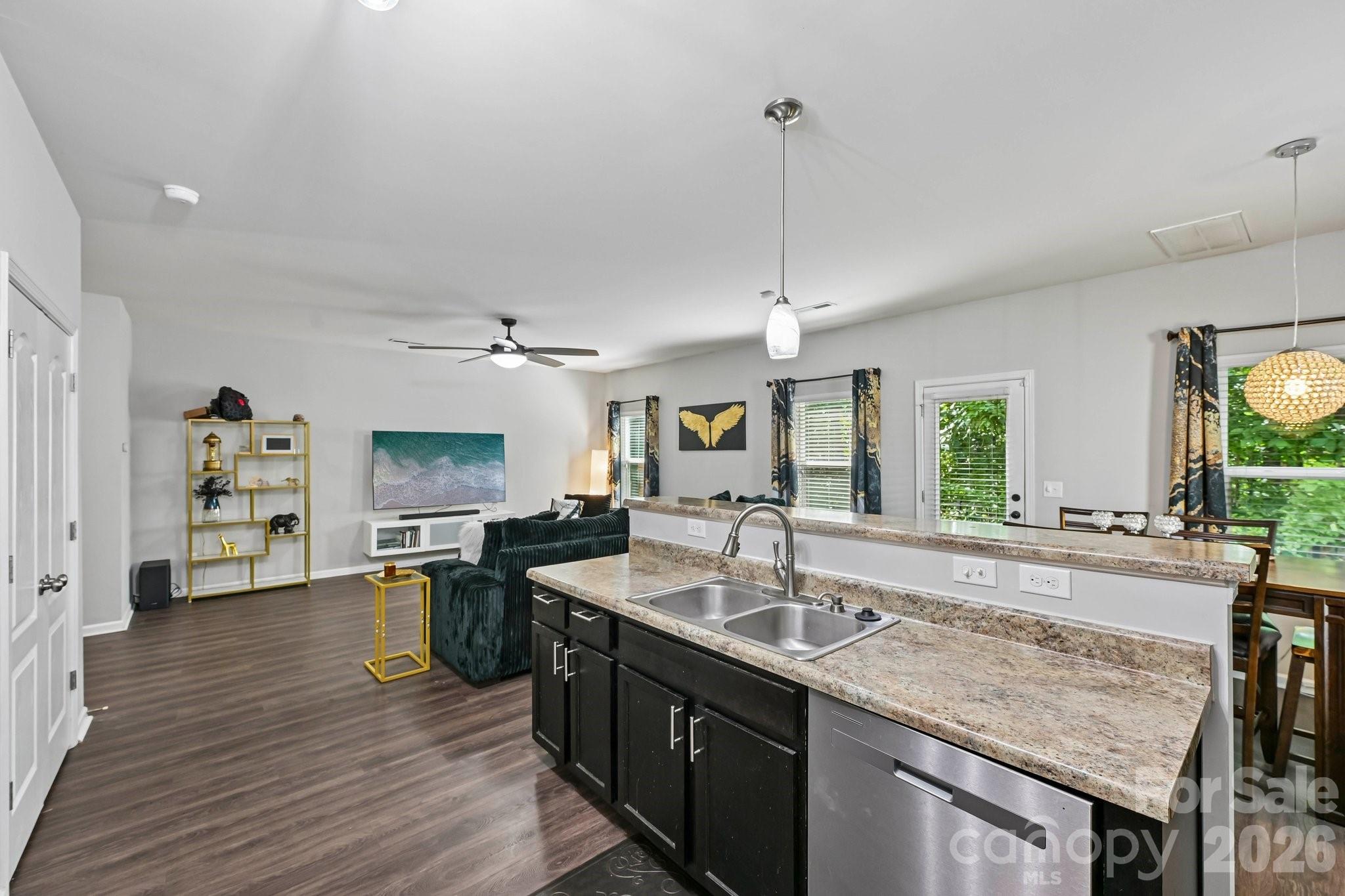 2206 Turtle Point Road Charlotte, NC 28262 - Photo 10 of 28 a kitchen with granite countertop a sink counter top space and stainless steel appliances