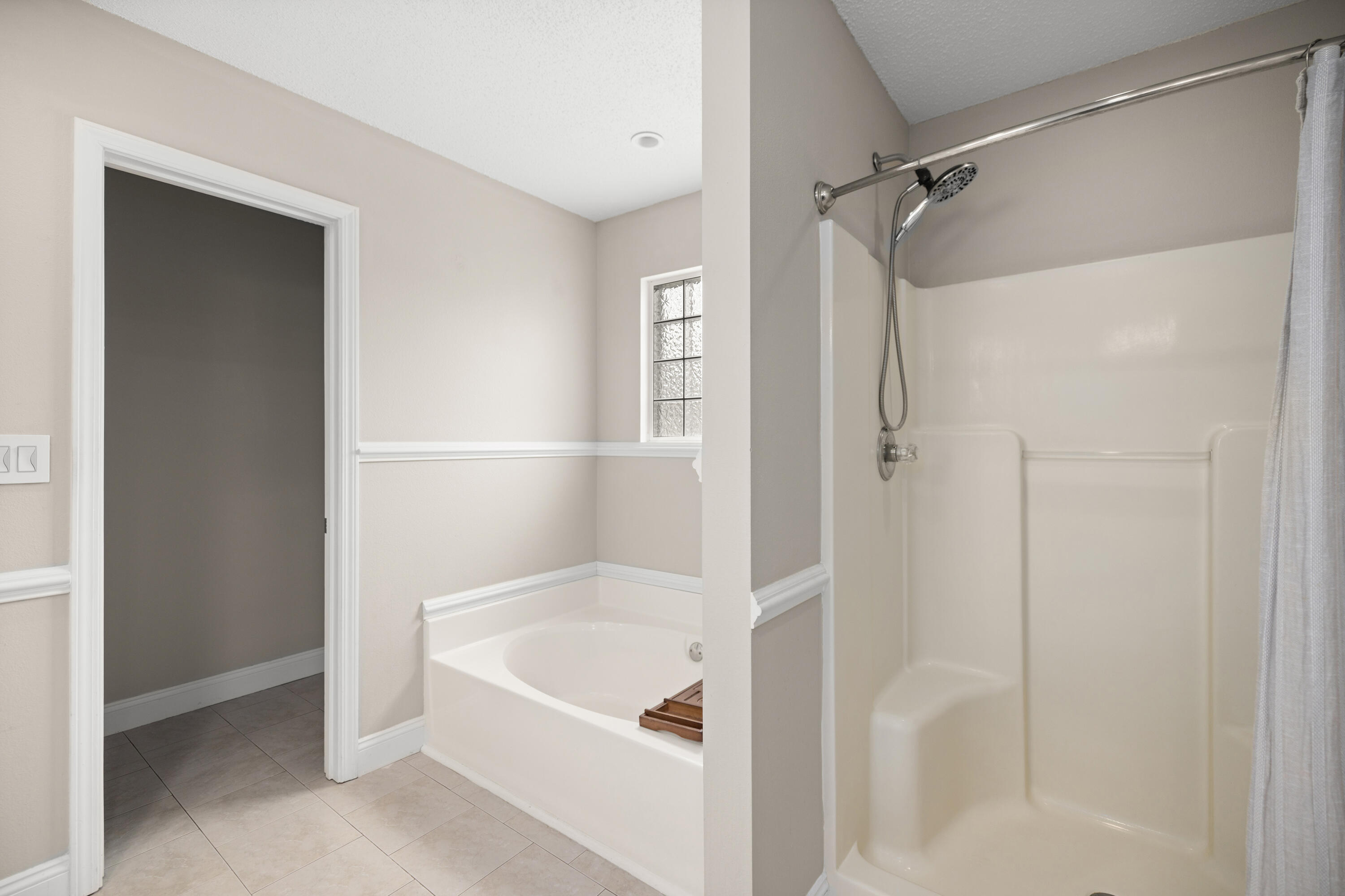 202 Limestone Circle Crestview, FL 32539 - Photo 24 of 49 a bathroom with a bathtub and a shower