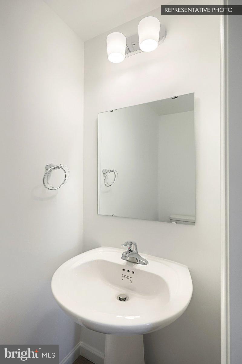 241 Abercorn Street State College, PA 16803 - Photo 7 of 21 a bathroom with a sink and a mirror