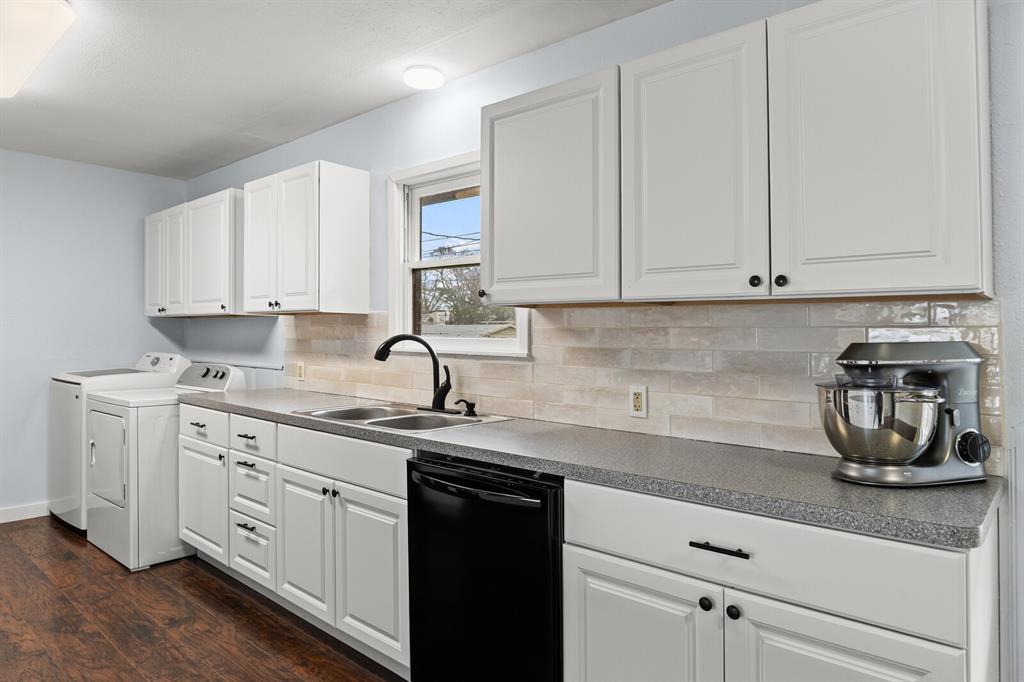 2506 South 24th Street Waco, TX 76706 - Photo 16 of 39 a kitchen with white cabinets and a sink