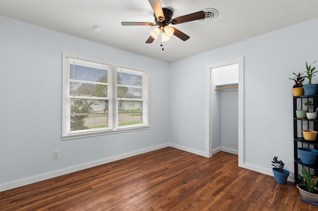 2506 South 24th Street Waco, TX 76706 - Photo 24 of 39 a view of an empty room with a window and wooden floor