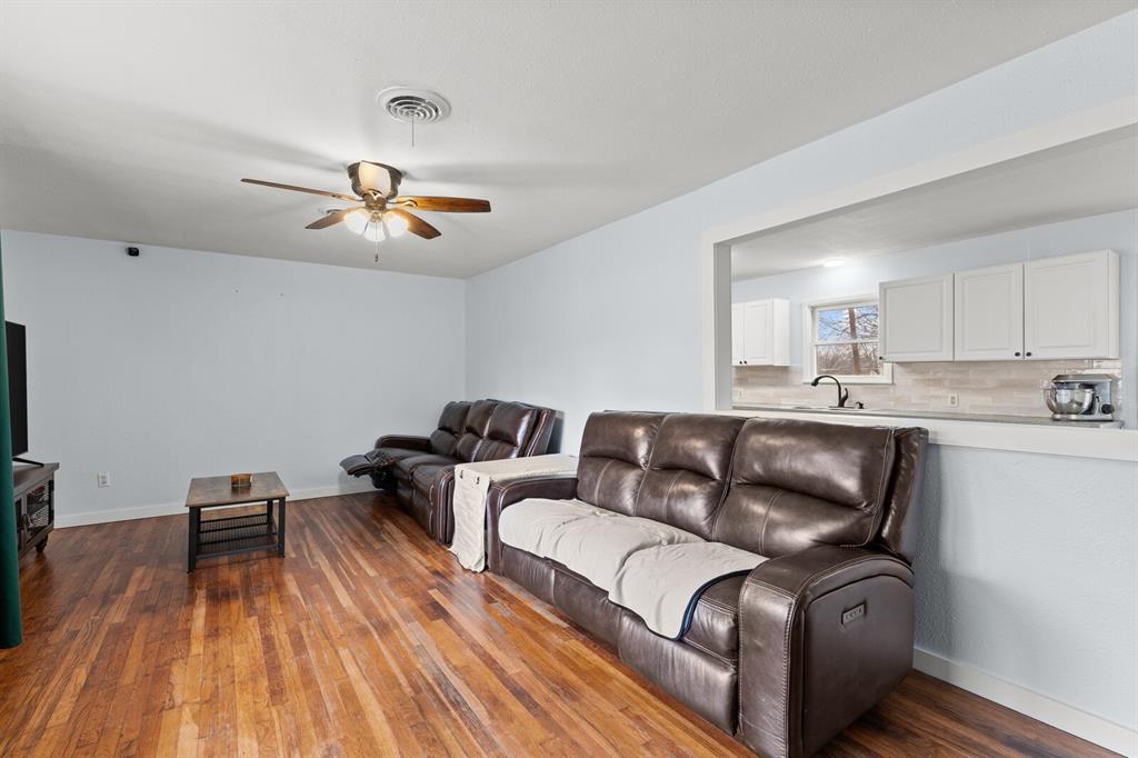 2506 South 24th Street Waco, TX 76706 - Photo 7 of 39 a living room with furniture and wooden floor