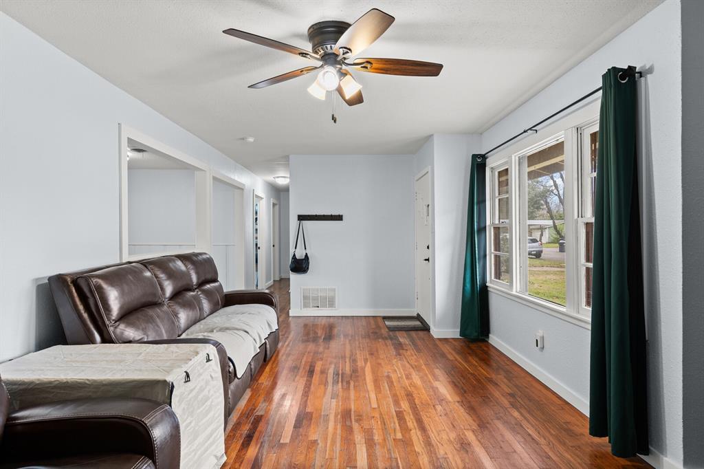 2506 South 24th Street Waco, TX 76706 - Photo 8 of 39 a living room with a bed furniture and a large window