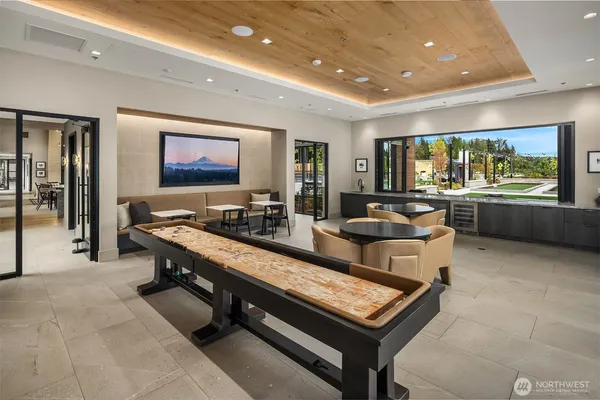 a living room with furniture a rug and a flat screen tv