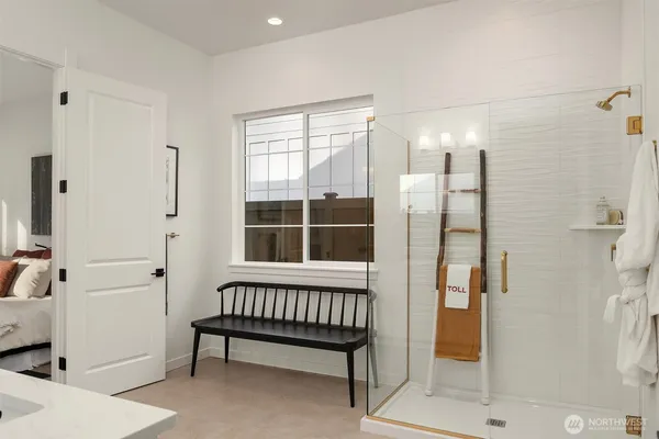 a bathroom with a window and a shower