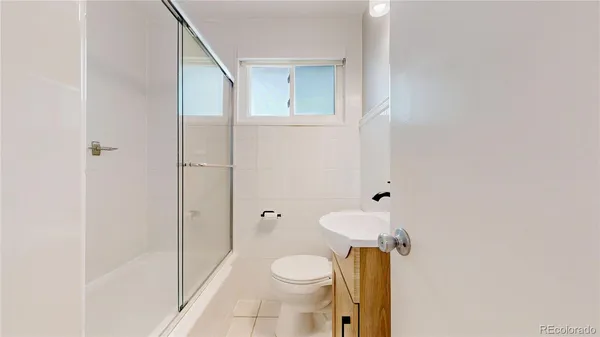 a view of a hallway with washer and dryer