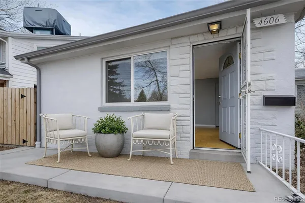 a view of a house with a chair and a potted plant