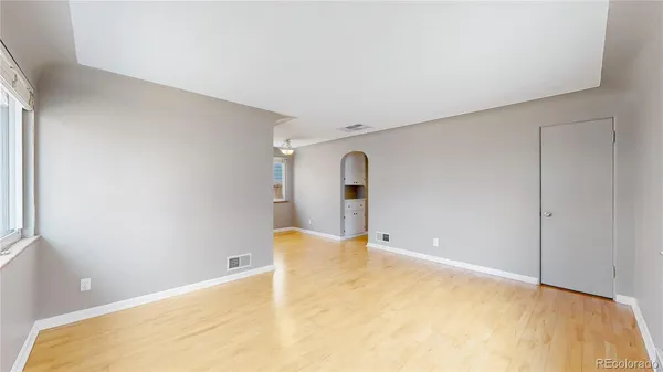 a view of a big room with closet and mirror