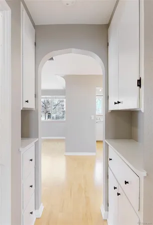 a spacious bedroom with a bed and closet with wooden floor