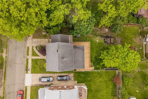 aerial view of a house with a yard