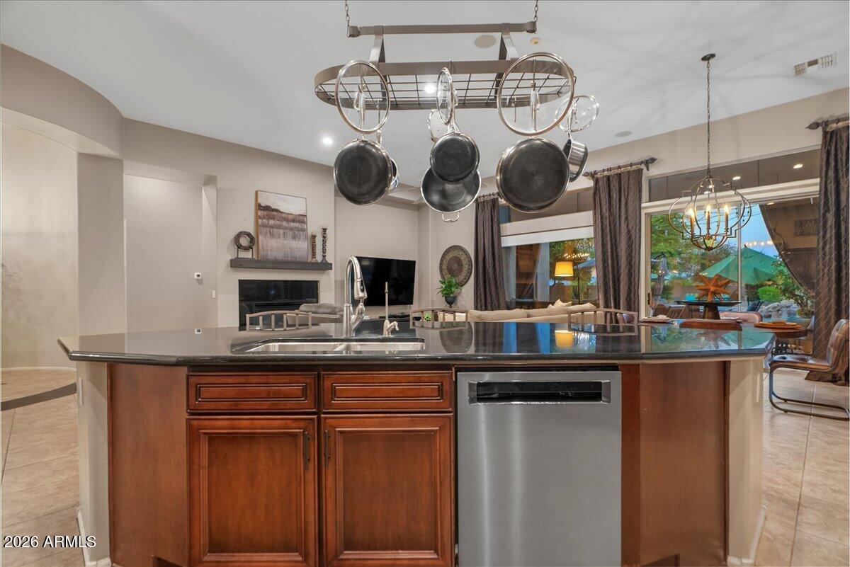 6427 South Magic Court Gilbert, AZ 85298 - Photo 27 of 71 a kitchen with stainless steel appliances granite countertop a sink and cabinets