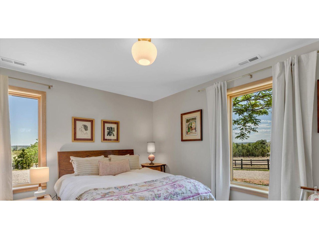 9773 Phillips Road Lafayette, CO 80026 - Photo 25 of 46 a bedroom with a bed and a window