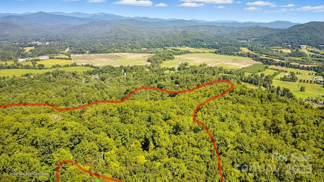 a view of a town with mountains in the background