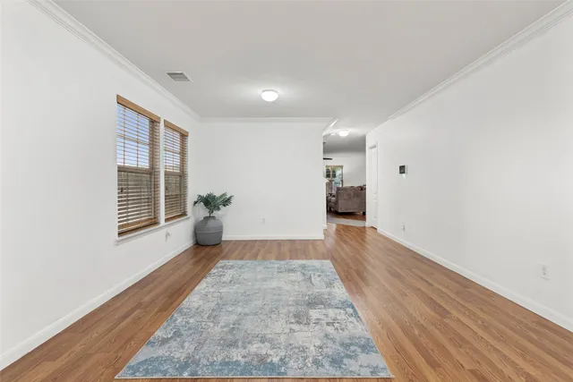 a view of a livingroom with furniture and a potted plant