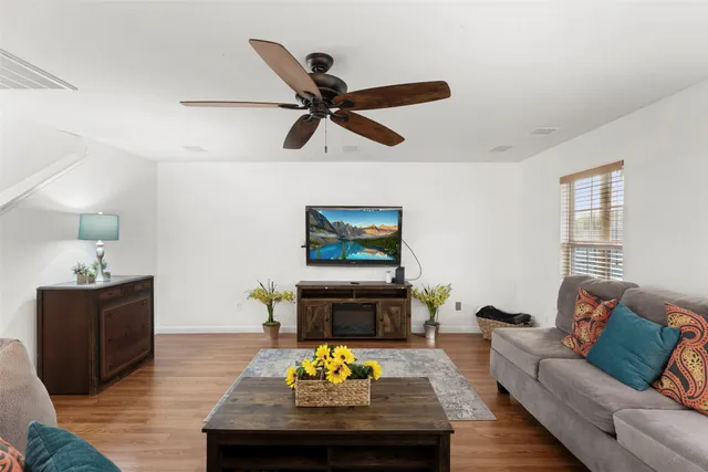 a kitchen with furniture a stove and a refrigerator