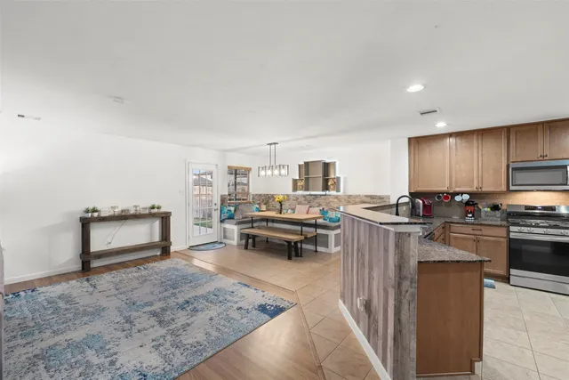 a bedroom with furniture and a chandelier