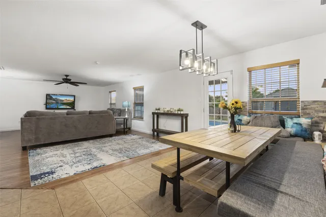 a kitchen with a sink stove top oven and cabinets