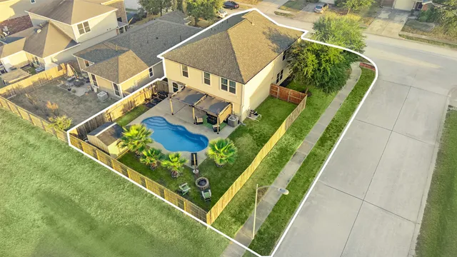 swimming pool view with seating area