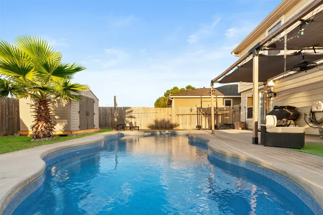 a view of a swimming pool with a lounge chair