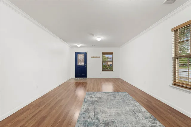 a view of an empty room and window