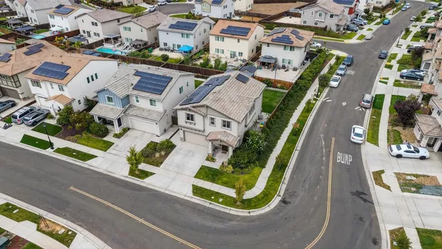 an aerial view of residential houses with outdoor space