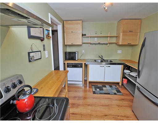 2521 Hunting Ridge Trail Bridgeville, PA 15017 - Photo 8 of 14 Kitchen. Updated Euro style kitchen with pergo floors....eat in space.......leads directly to dining room...notice open stairway to 2nd floor.