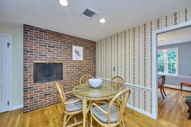 a kitchen with granite countertop a table and chairs in it