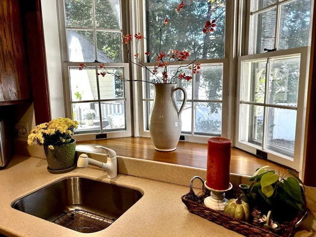 a kitchen with a sink and a large window