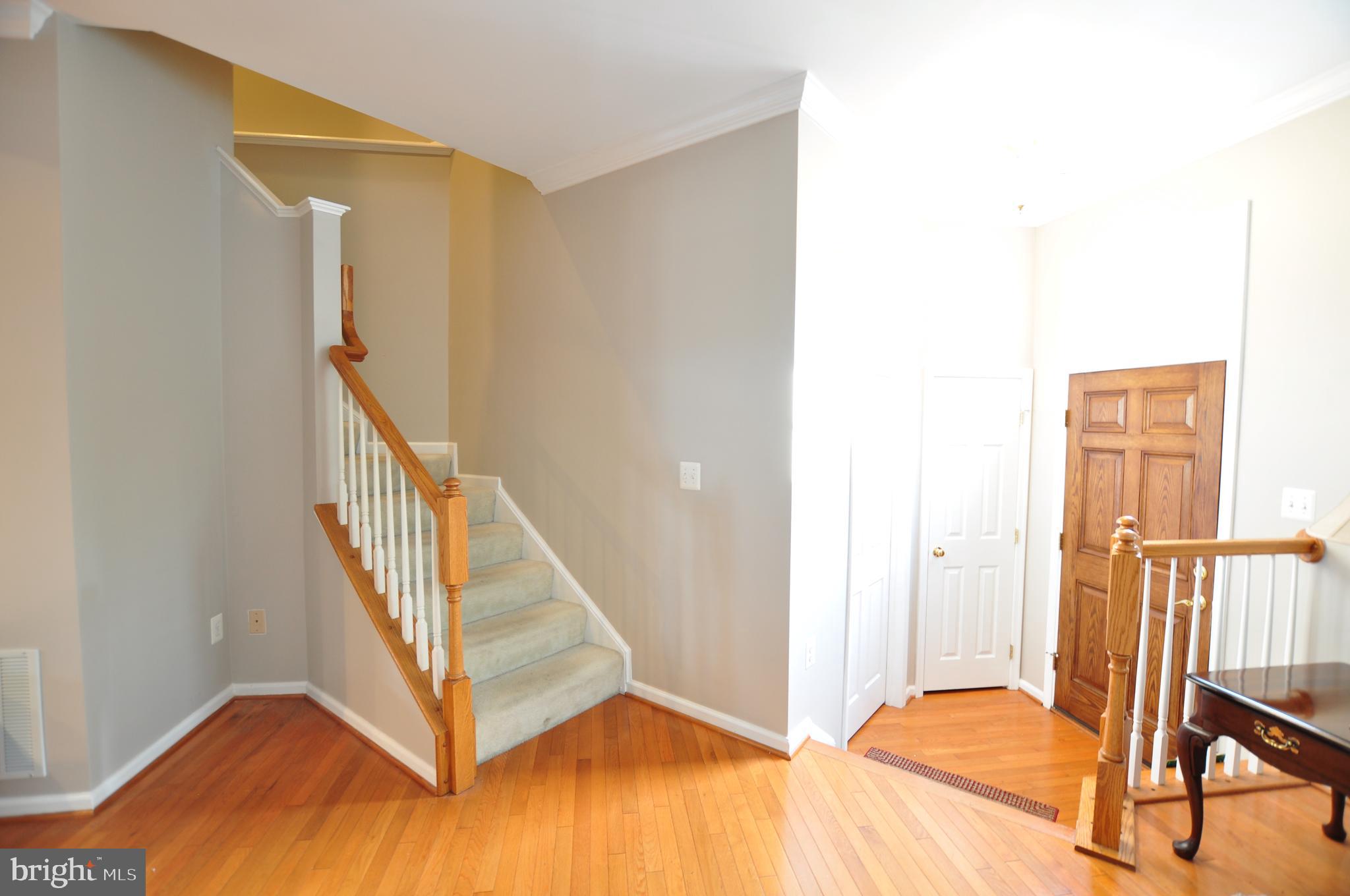 146 Riparian Lane Ranson, WV 25438 - Photo 4 of 42 Foyer entrance w/oak railing accents!