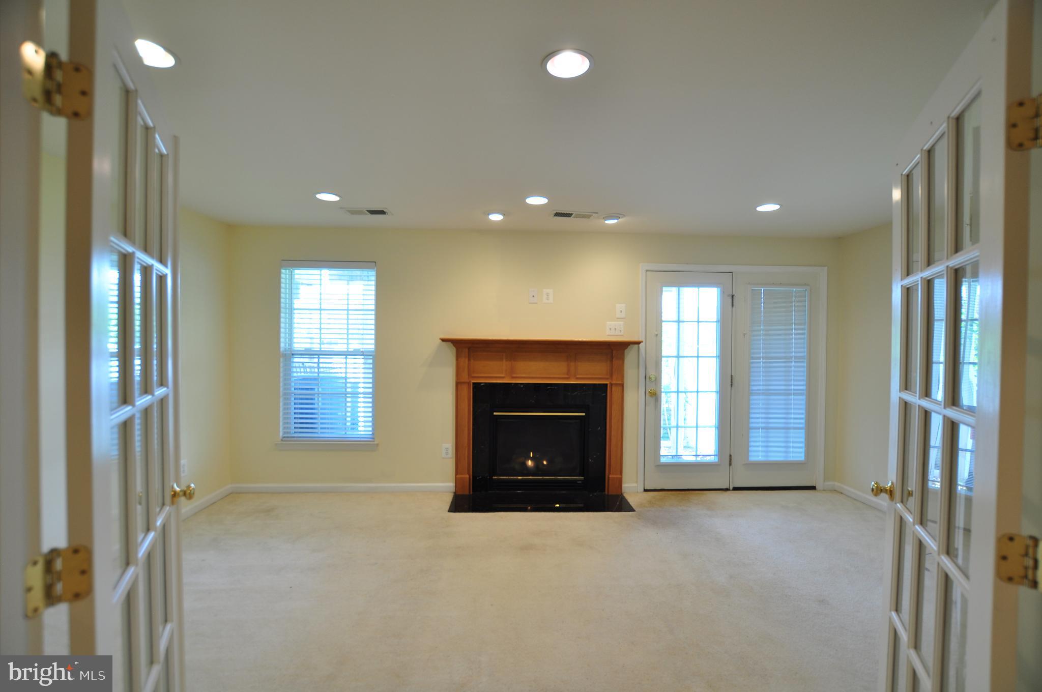 146 Riparian Lane Ranson, WV 25438 - Photo 34 of 42 French door entrance to cozy den w/gas fireplace!
