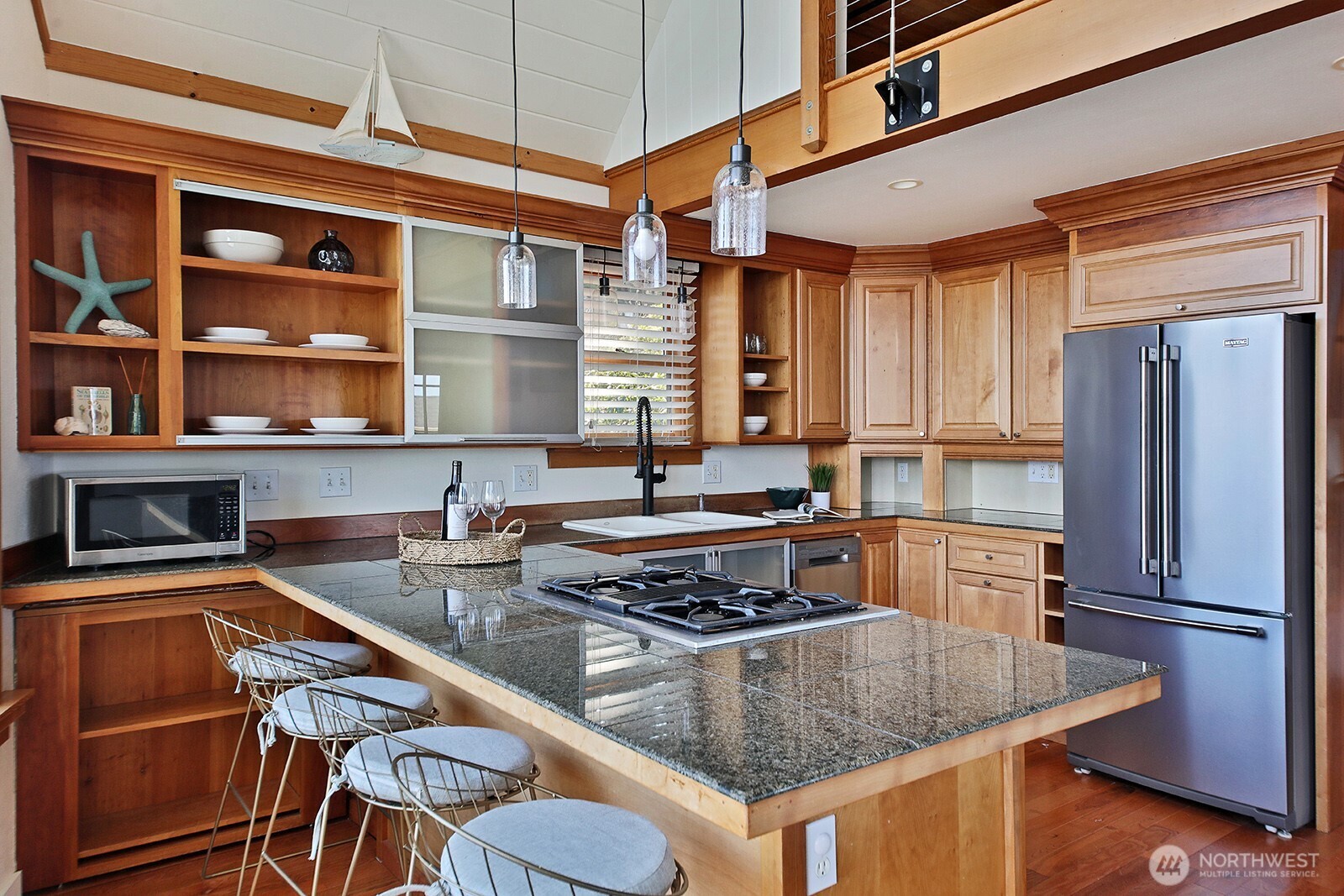 2282 East Whidbey Shores Road Langley, WA 98260 - Photo 11 of 38 a kitchen with stainless steel appliances granite countertop a stove and a refrigerator