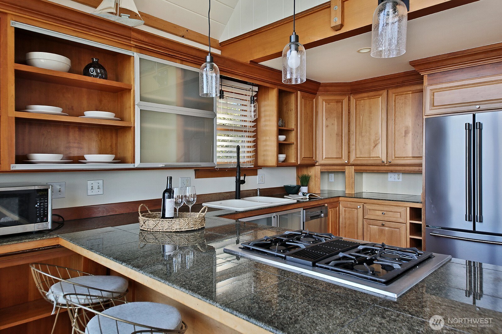 2282 East Whidbey Shores Road Langley, WA 98260 - Photo 12 of 38 a kitchen with stainless steel appliances granite countertop a sink stove and refrigerator