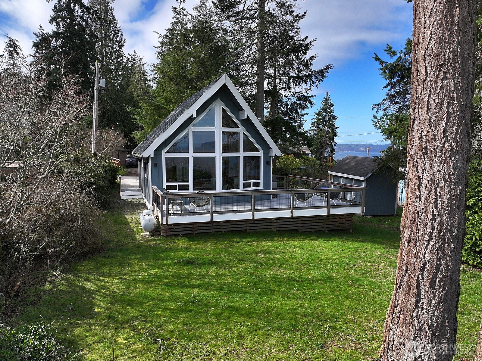 2282 East Whidbey Shores Road Langley, WA 98260 - Photo 3 of 38 a front view of a house with a garden