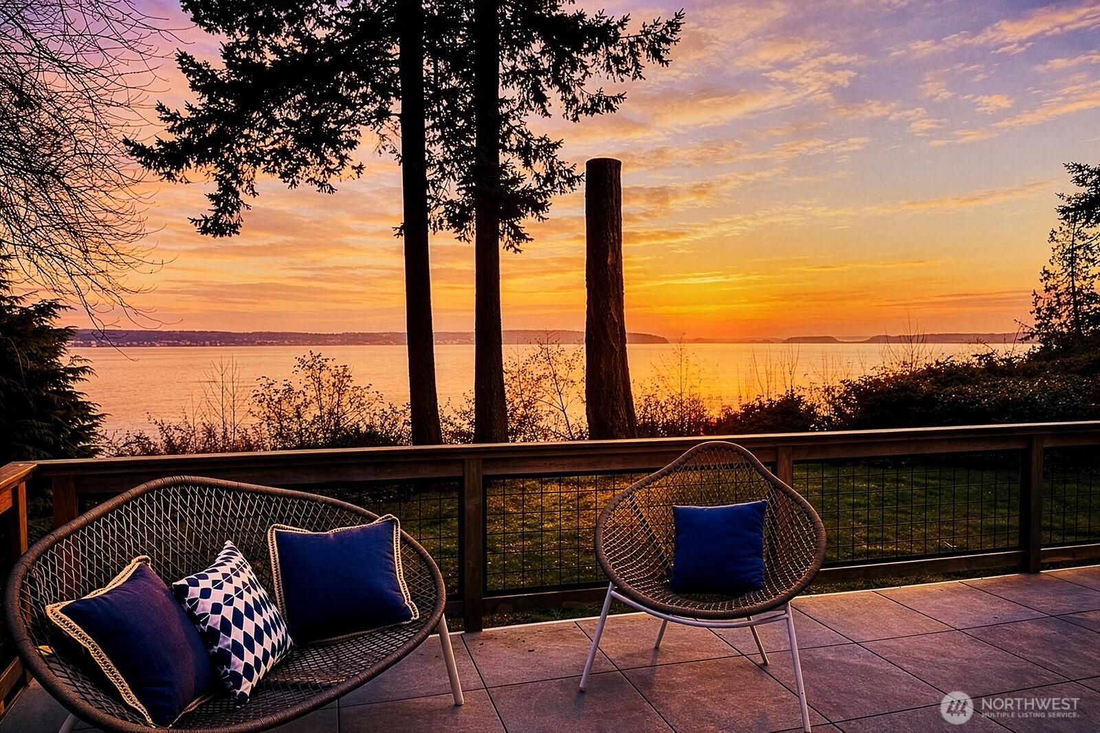 2282 East Whidbey Shores Road Langley, WA 98260 - Photo 33 of 38 a view of a balcony with chairs and a potted plant