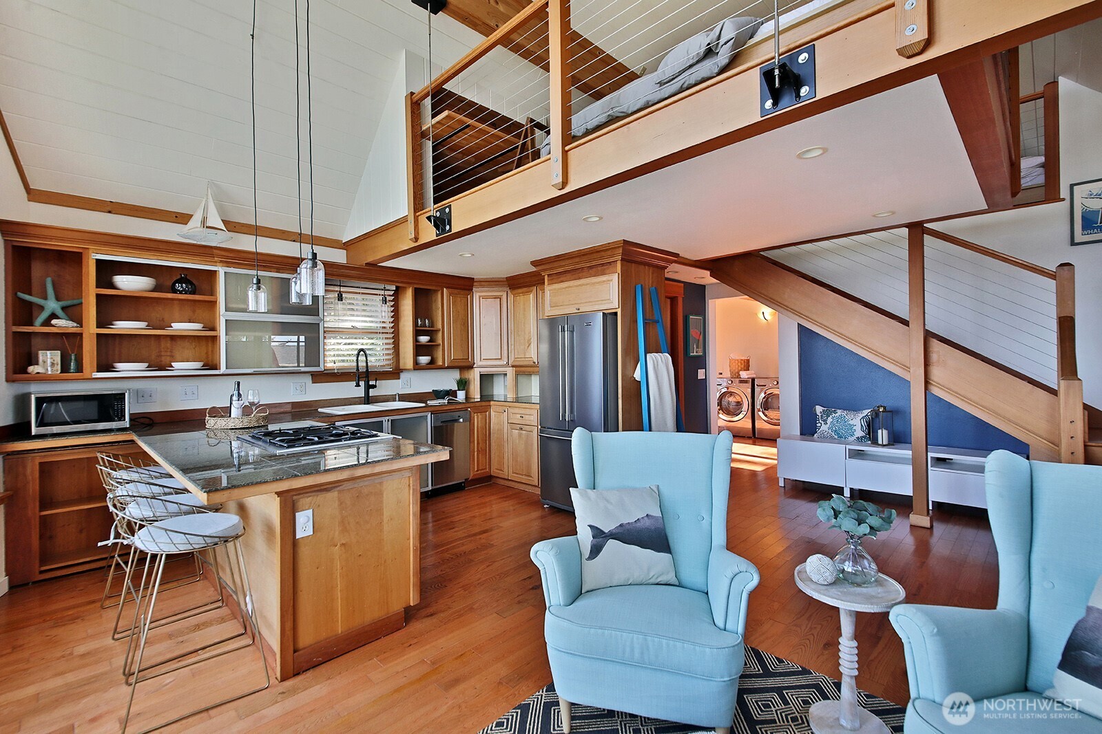 2282 East Whidbey Shores Road Langley, WA 98260 - Photo 7 of 38 a dining room with furniture and wooden floor
