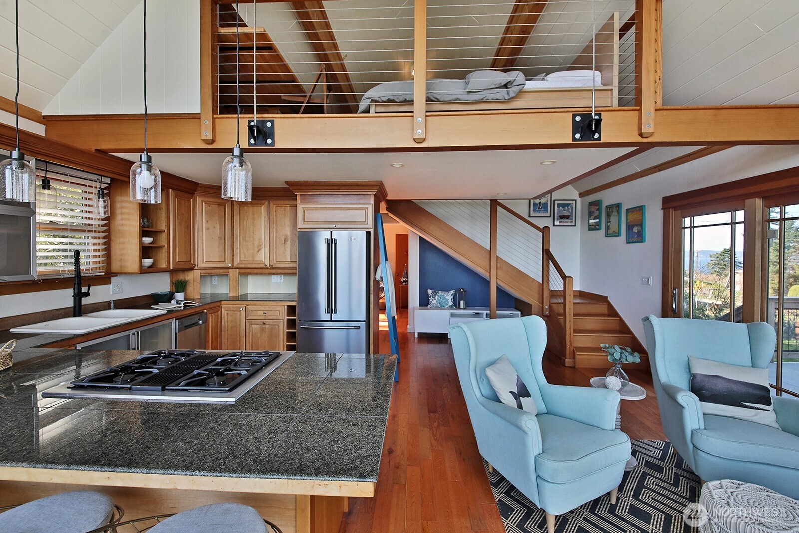 2282 East Whidbey Shores Road Langley, WA 98260 - Photo 8 of 38 a kitchen with a stove and white cabinets