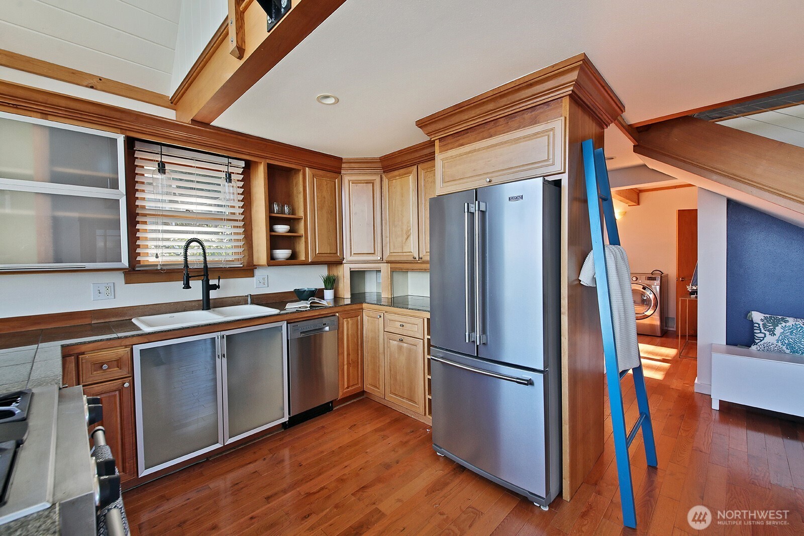 2282 East Whidbey Shores Road Langley, WA 98260 - Photo 10 of 38 a kitchen with stainless steel appliances granite countertop a refrigerator a sink and a stove