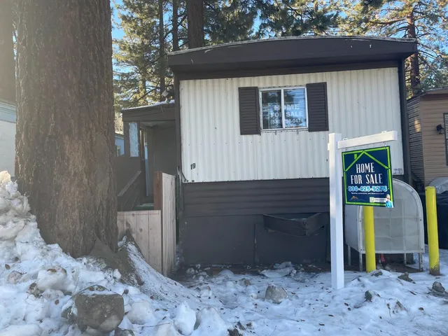 a front view of a house with parking