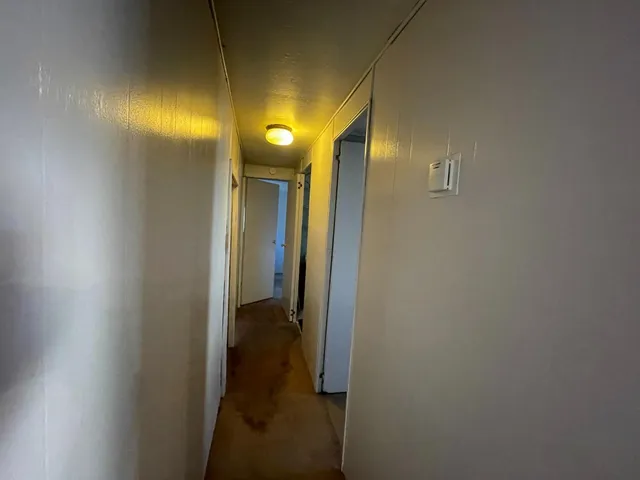 a view of a bathroom from a hallway