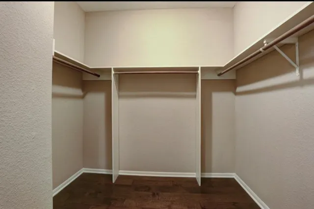 a view of an empty walk in closet